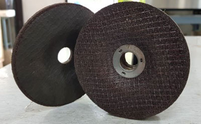 Rapid curing of resin bonded grinding wheels